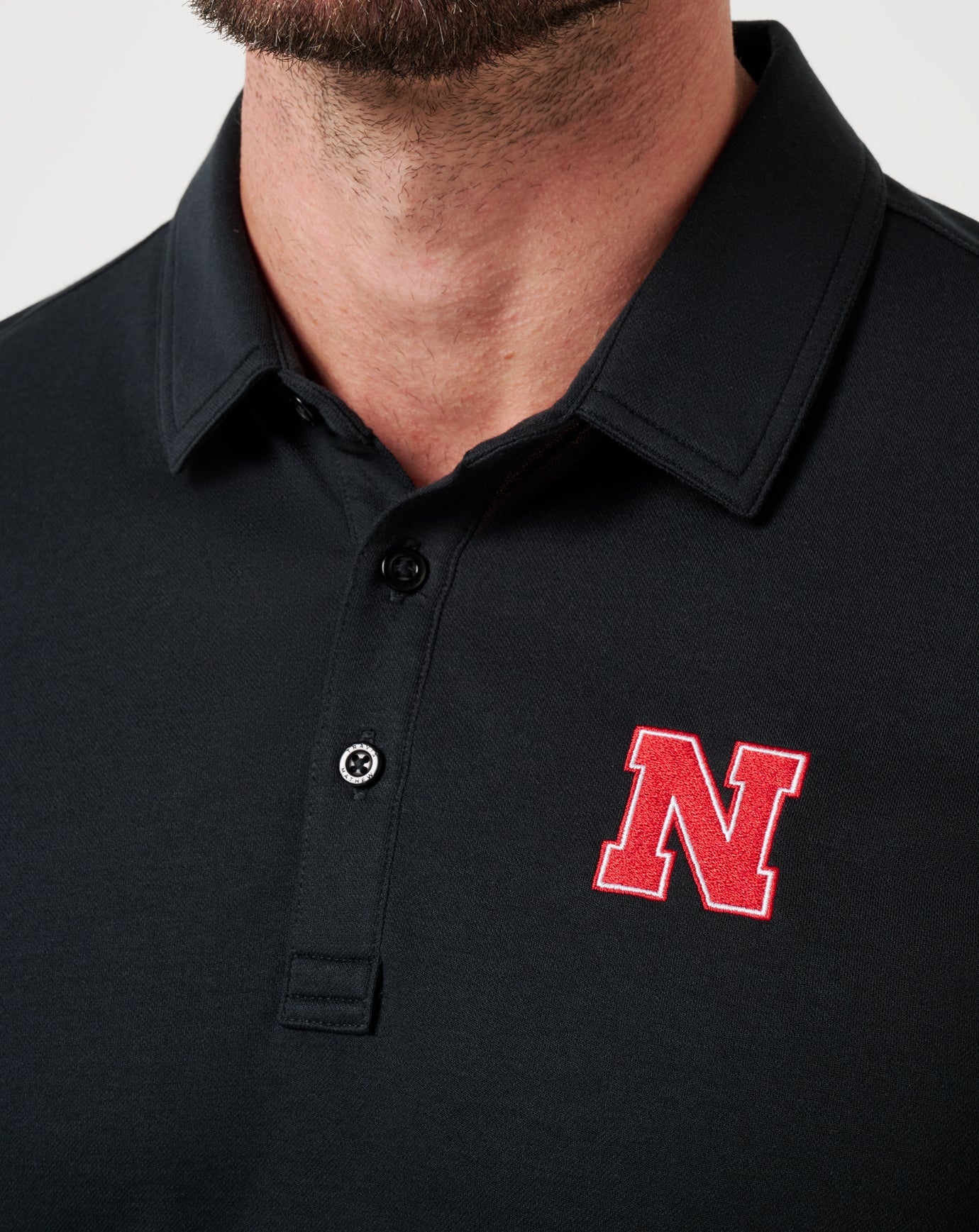 Travis Mathew Nebraska School Pride Polo